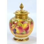 A Royal Worcester fruit painted gilt heightened pot pourri jar and cover of lobed form,