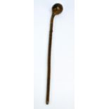 A Fijian Ula Kobu with shaped bulbous end, gnarled shaft and incised decoration to the grip,