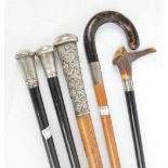 A tortoiseshell handled malacca shafted walking stick with silver collar,