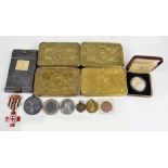 A collection of militaria comprising four Christmas 1914 tins, a WWI Victory Medal, Queen's Reg.