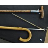 A novelty Edwardian horse measuring 'gadget' walking stick and a further 'gadget' walking stick