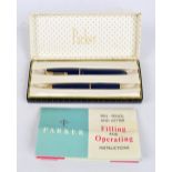 A boxed Parker 'Slim Fold' fountain pen with 14ct yellow gold nib and a matching propelling pencil