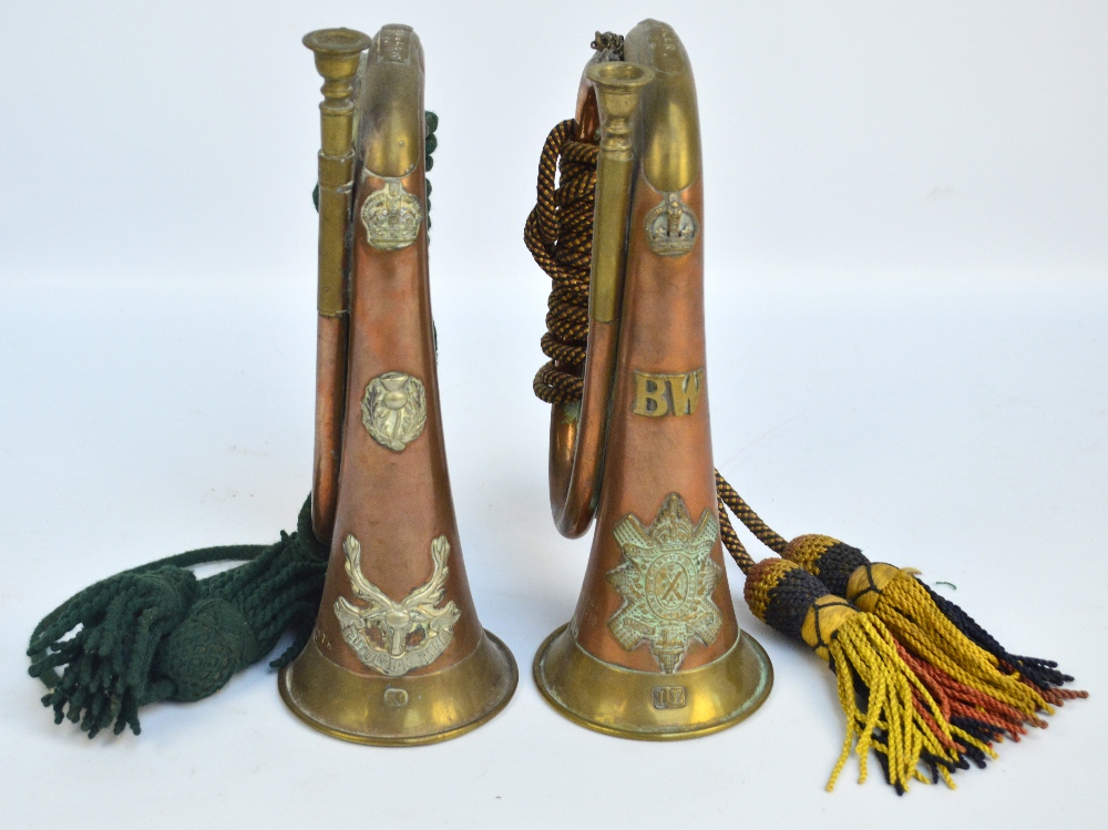 Two regimental bugles with cords and tassels for Royal Highlanders and Seaforth Highlanders,