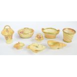 A collection of various Royal Worcester blush ivory predominantly wicker effect decorated items to