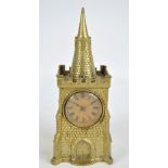 A novelty early 20th century brass time piece modelled as a clock tower,
