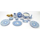 A small collection of Wedgwood blue jasperware to include trinket boxes and circular pin dishes,
