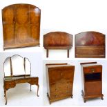 A five piece walnut bedroom suite comprising triple wardrobe, tallboy, dressing table,