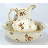 An early 20th century Limoges chamber jug and bowl with painted and gilt decoration on cream ground,