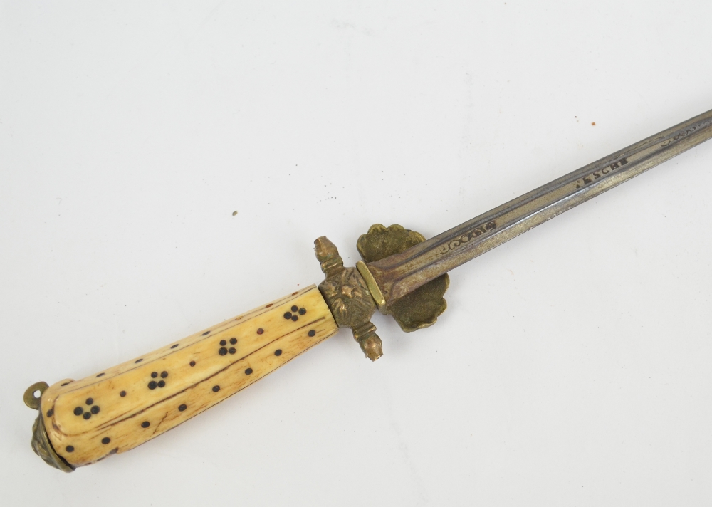 An early 19th century continental hunting sword with bone handle and tapering blade, length 75cm.
