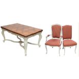 A French oak draw leaf dining table and eight chairs,