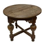 A circular foldover table, with pierced brackets to the apron, inverted baluster supports to blocks,