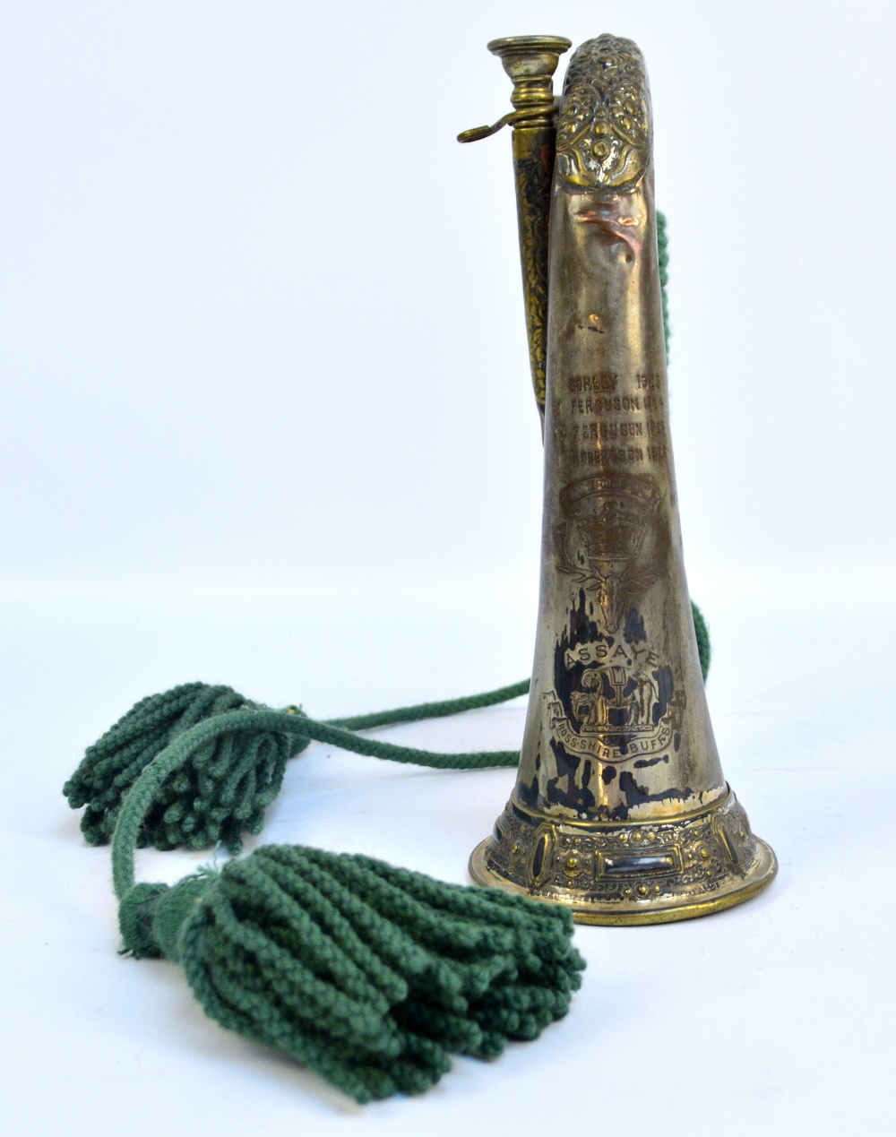 A bugle with cord and tassels for Rosshire Buffs, engraved names and dates (1920s and 30s) to body,