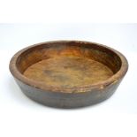 A 19th century sycamore dairy bowl with traces of original painted detail, diameter 58cm.