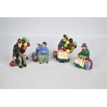 Four Royal Doulton figures, HN1315 'The Balloon Seller', HN1954 'The Balloon Man' (af),