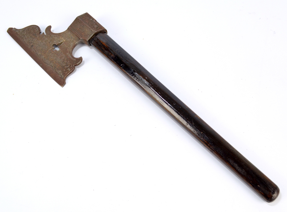 An ebonised shafted axe with foliate scroll and bird decorated engraved blade, length 54.5cm.