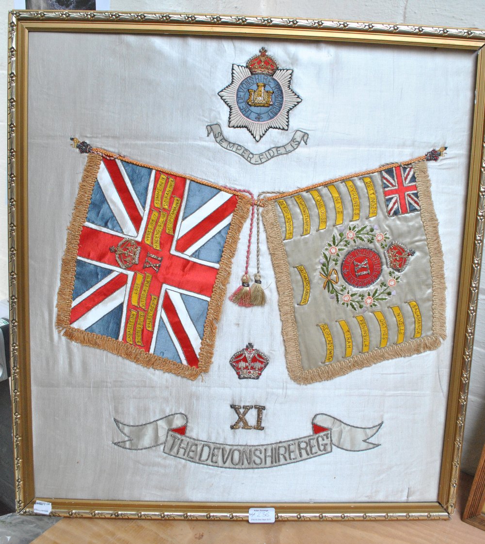 An embroidered silk panel commemorating the XI Devonshire Regiment, 66 x 60cm, framed.