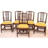 Five Edwardian mahogany dining chairs with lattice detailing and green upholstered seats (5).