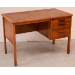 A mid-20th century oak desk with pull-out work surface and two graduated doors to right-hand side,