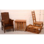 An early 20th century oak reclining armchair, a nest of four folding teak occasional tables,