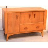 A 1950s G-Plan oak Brandon sideboard, two cupboard doors over single drawer,