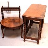 A late Victorian oak gate-leg table raised on twist supports,