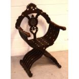 A 19th century Anglo-Indian carved Savonarola chair, the finely detailed seat,