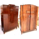 A 1920s oak single-door wardrobe raised on shepherd castors, height 187cm,