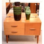 A mid-20th century teak dressing table of small proportions comprising two short drawers and a