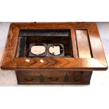 A late 19th century Japanese oak hibachi (stove), length 74cm.