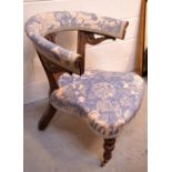 A Victorian walnut curved back salon chair with French toile floral upholstery,