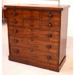 A Victorian mahogany chest of drawers comprising two central short drawers flanked by two deep faux