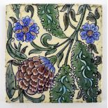 WILLIAM DE MORGAN; a large square sectioned tile painted with pink and blue floral sprays,