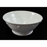 KEITH BRYMER JONES; a large white stoneware bowl with applied decoration, impressed mark,