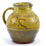 MICHAEL CARDEW (1901-1983) for Winchcombe Pottery; a slipware jug, galena glaze,