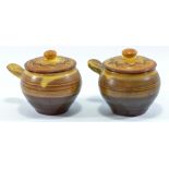 CHARLES TUSTIN (1922-1996) for Winchcombe Pottery; a pair of slipware covered soups,