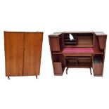 A 1960s/70s walnut compactum desk, the twin front cupboard doors enclosing file drawers,