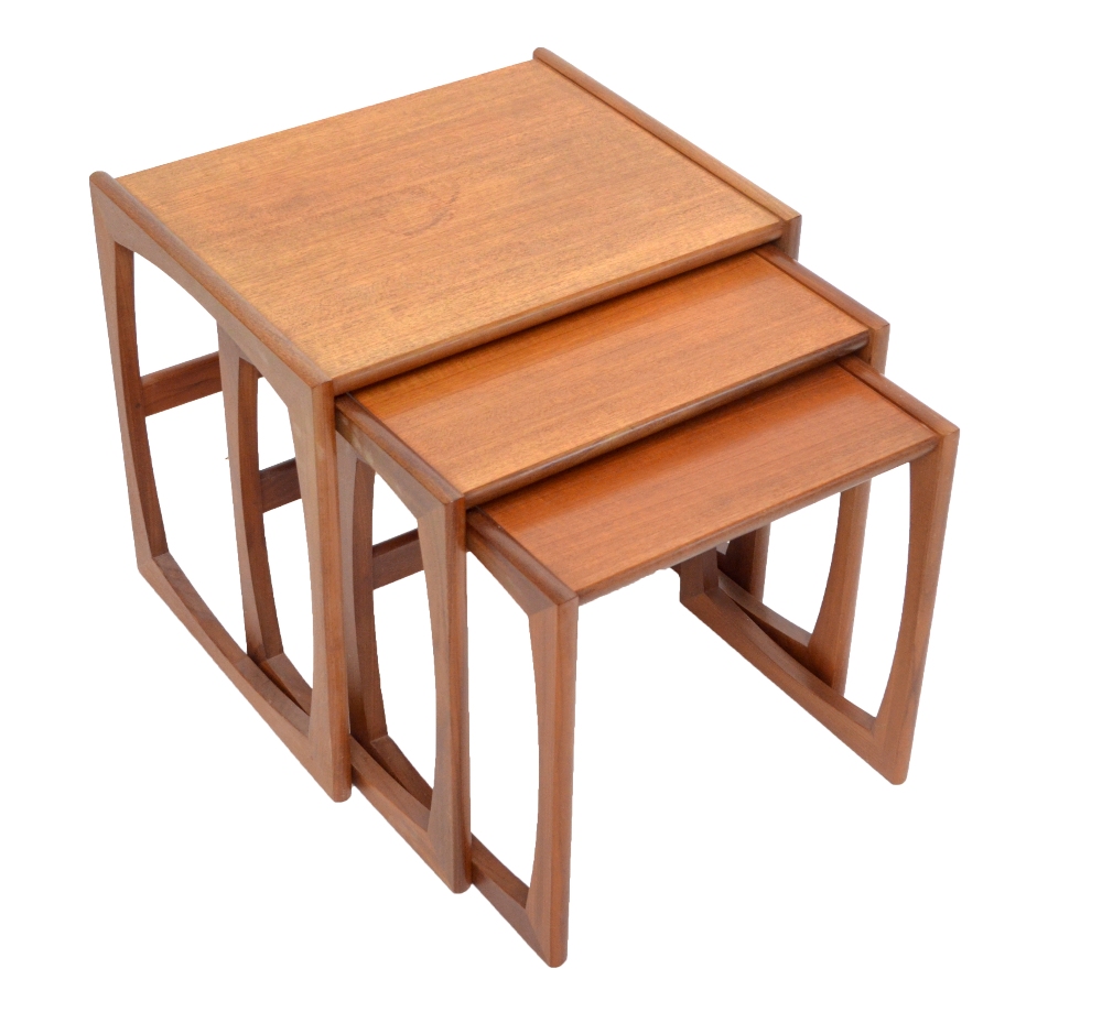 G PLAN; a nest of three rectangular occasional tables with shaped end uprights and supports.