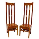 A pair of modern hardwood high backed chairs after a design by Charles Rennie Mackintosh and raised