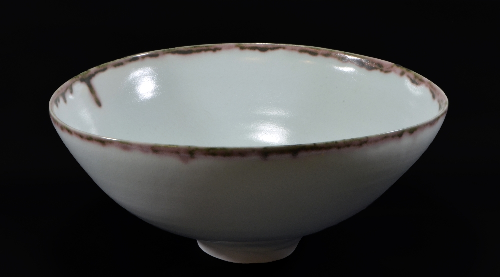 EDMUND DE WAAL (born 1964); a very large porcelain footed bowl, copper red and manganese rim,