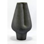 WAISTEL COOPER (1921-2003); a stoneware vessel with indented side covered in matt black glaze,