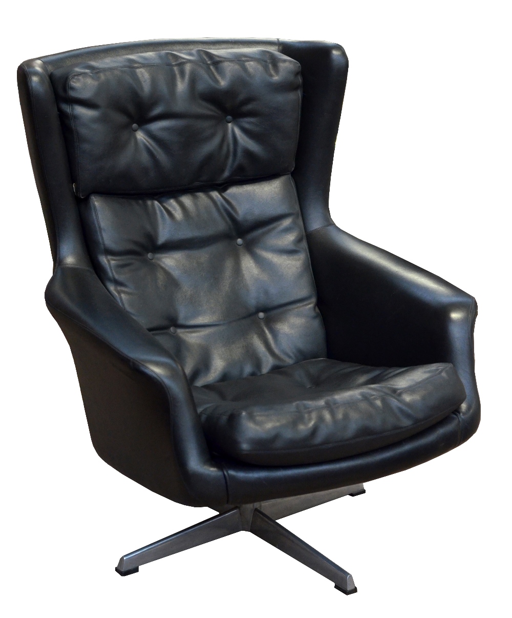 DUX OF SWEDEN; a 1960s black 'Egg' leatherette button padded easy wing back swivel chair,