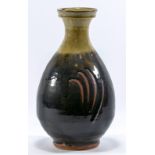 JIM MALONE (born 1946); a stoneware bottle covered in tenmoku and green ash glaze to the neck,