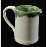 JAMES GREENWOOD; a small porcelain jug, incised and impressed marks, height 9.5cm.