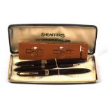 A cased set of three Sheaffer writing instruments comprising 'Snorkel' fountain pen with nib