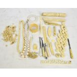 A quantity of bone and faux ivory items including handles, spatula, needle holder,