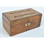 A 19th century walnut workhouse money box with two slots and three brass plaques inscribed 'Mrs