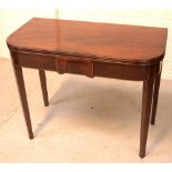 An early 19th century mahogany card table on tapering supports.