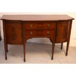An early 20th century mahogany and inlaid break-front sideboard with twin central drawers flanked