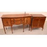 A reproduction serpentine-front inlaid mahogany sideboard of cupboards and drawers,