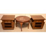 A pair of early 20th century oak magazine racks with central drawer and shelf, width 51.